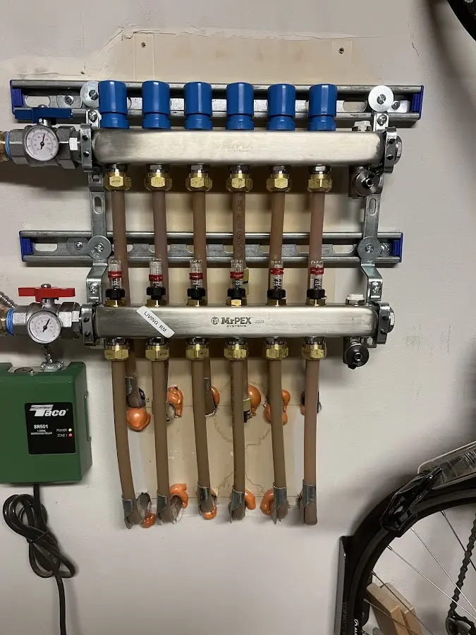 Plumber performing Water Heater Repair at a residential property in Winfield